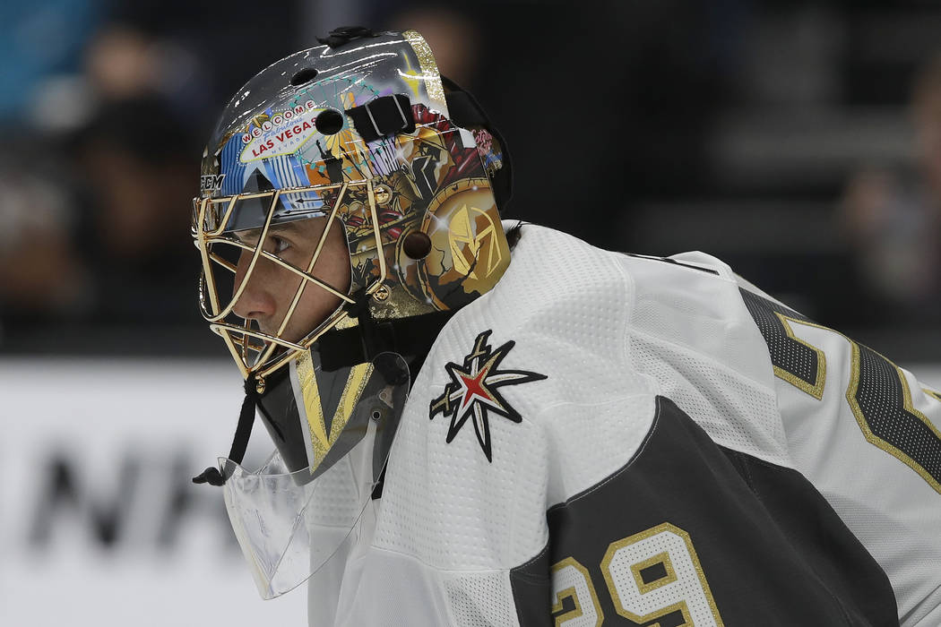 Vegas Golden Knights goaltender Marc-Andre Fleury watches action while defending his net during ...