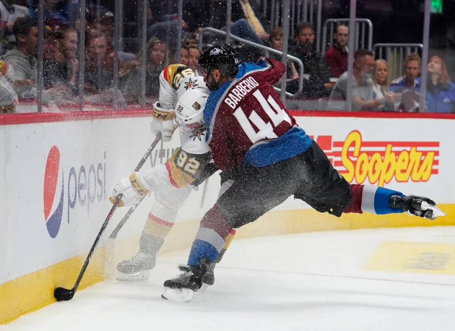 Colorado Avalanche defenseman Mark Barberio (44) hits Vegas Golden Knights left wing Tomas Nose ...