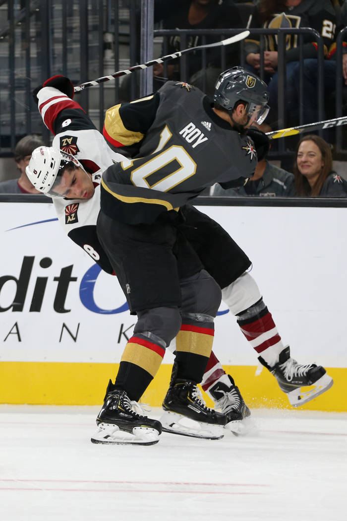 Vegas Golden Knights center Nicolas Roy (10) fouls Arizona Coyotes center Nick Schmaltz (8) dur ...