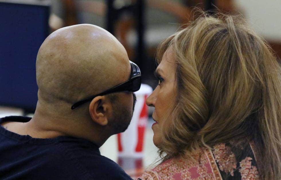 Gustavo Ramos-Martinez, convicted of killing two elderly people in 1998, listens to his Spanish ...