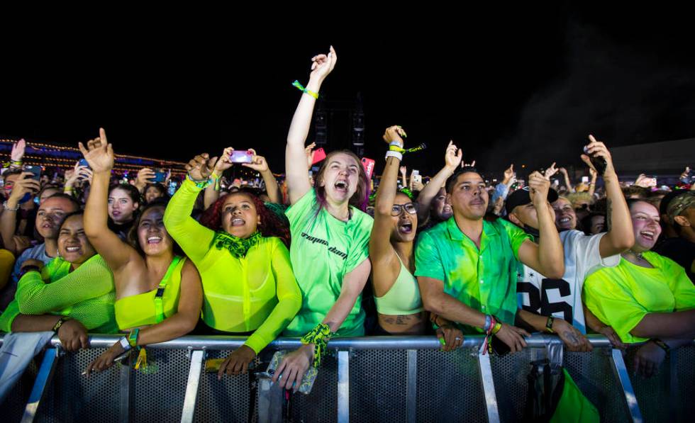 Fans react as Billie Eilish, not pictured, performs at the downtown stage during the first day ...