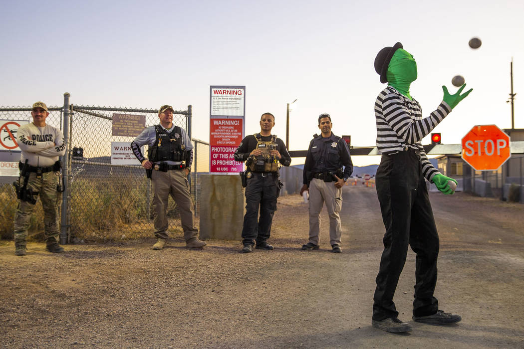 Scott Samford of Hollywood as an alien juggling mime entertains the security personnel at the b ...