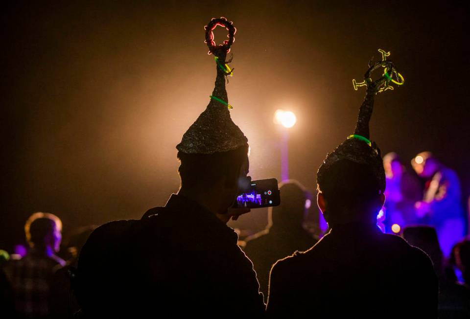 Festivilgoers listen to DJ Naavi on the EDM stage on night two of the Alienstock festival on Fr ...