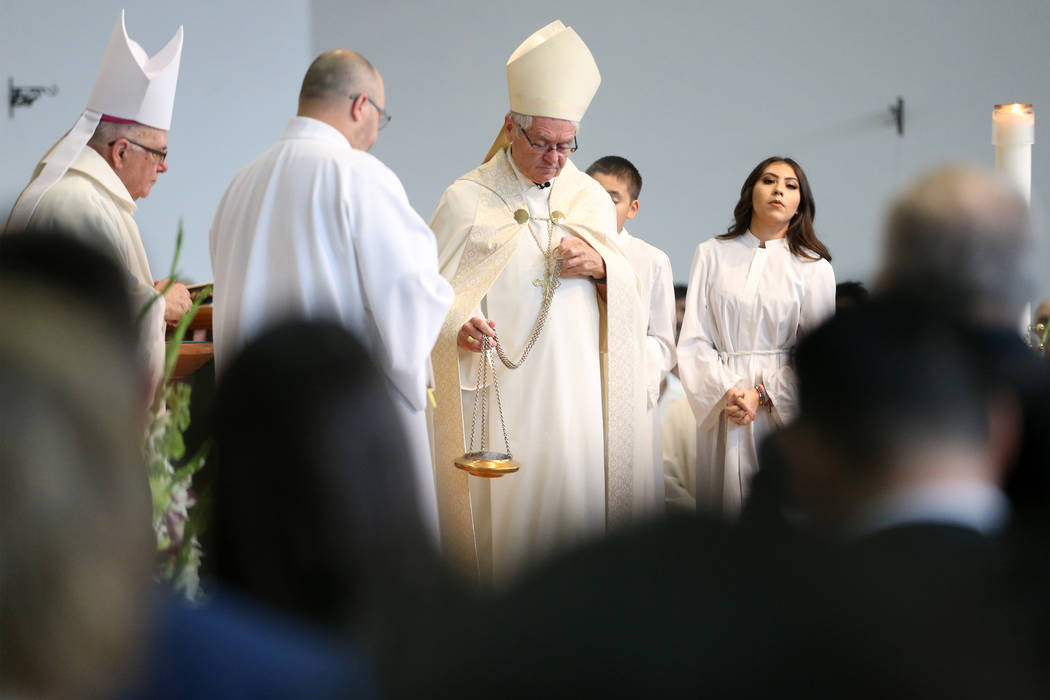 Bishop George Thomas, center, during the funeral mass for Paula Davis, an UNLV economic studen ...