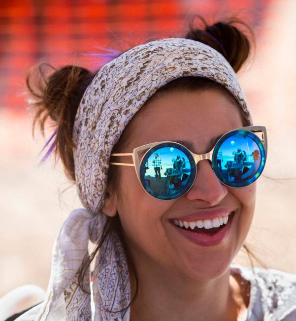 Marissol Martins of Los Angeles laughs with friends in her t-shirt stencil booth during the Ali ...