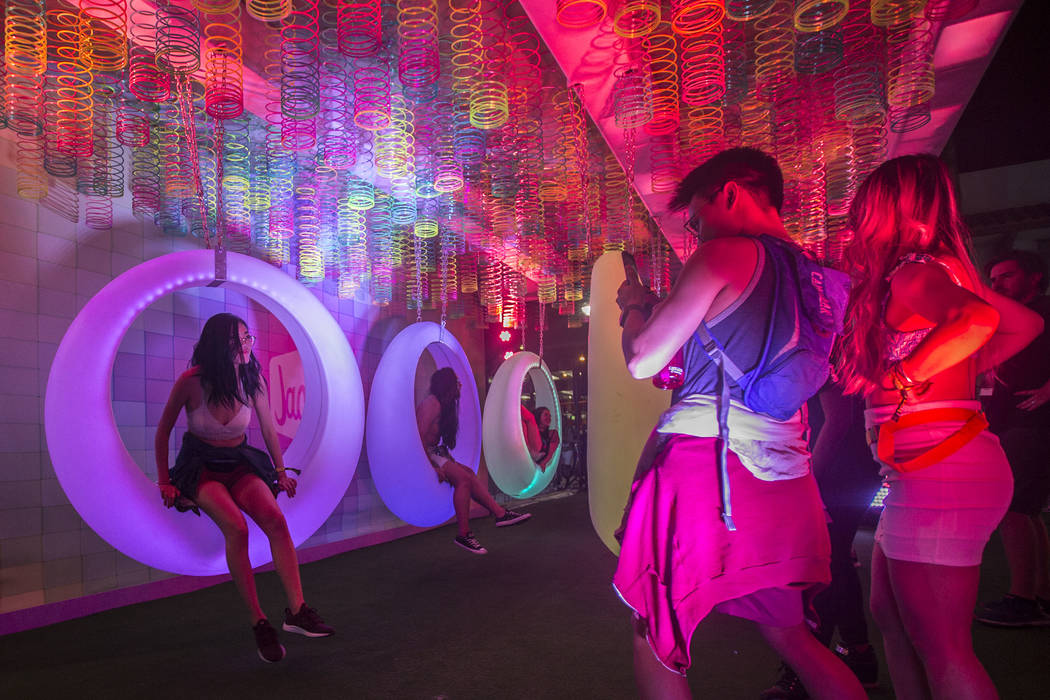 Festival goers pose for photos at Jack's Playground during the first day of Life is Beautiful o ...