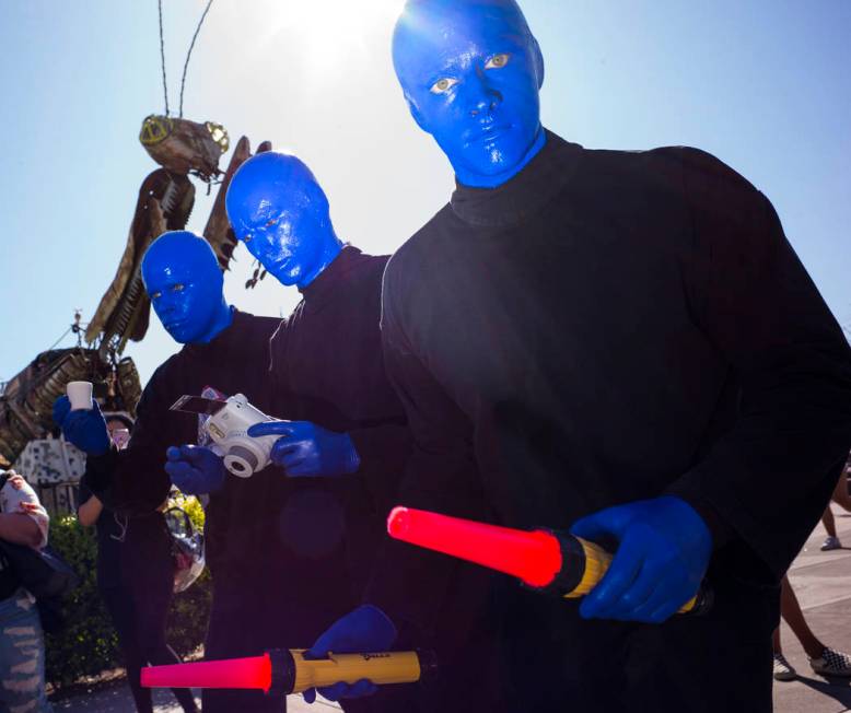 Members of the Blue Man Group roam the crowd during day 2 of the Life is Beautiful festival in ...