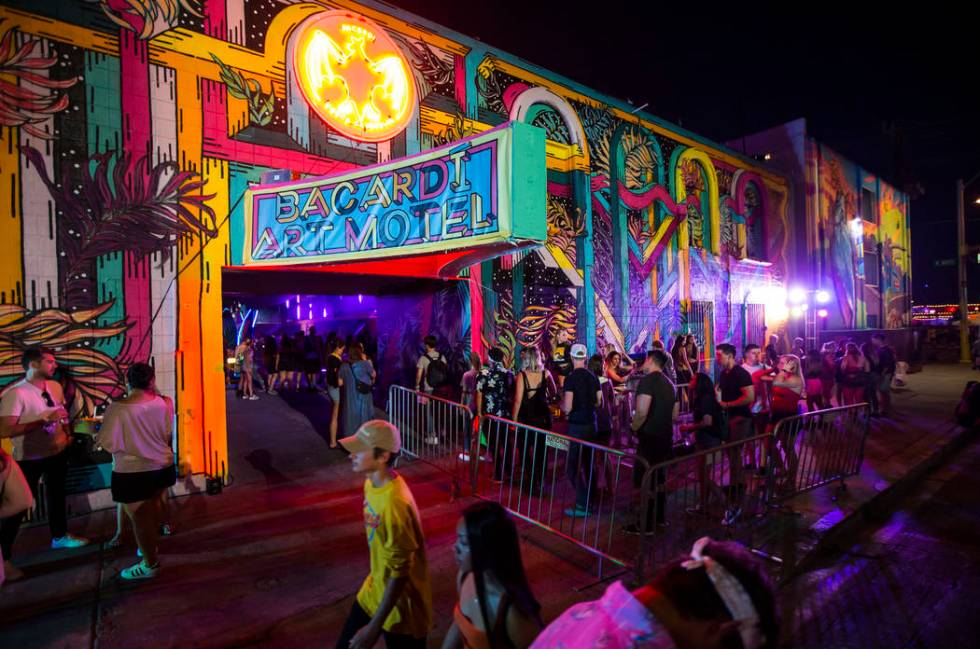 Attendees line up to get into the Bacardi Art Motel during day 2 of the Life is Beautiful festi ...