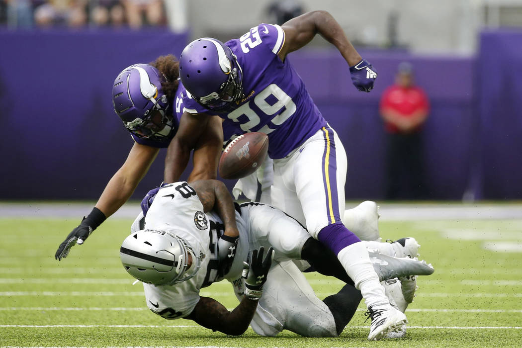 Oakland Raiders tight end Darren Waller fumbles after getting hit by Minnesota Vikings defender ...
