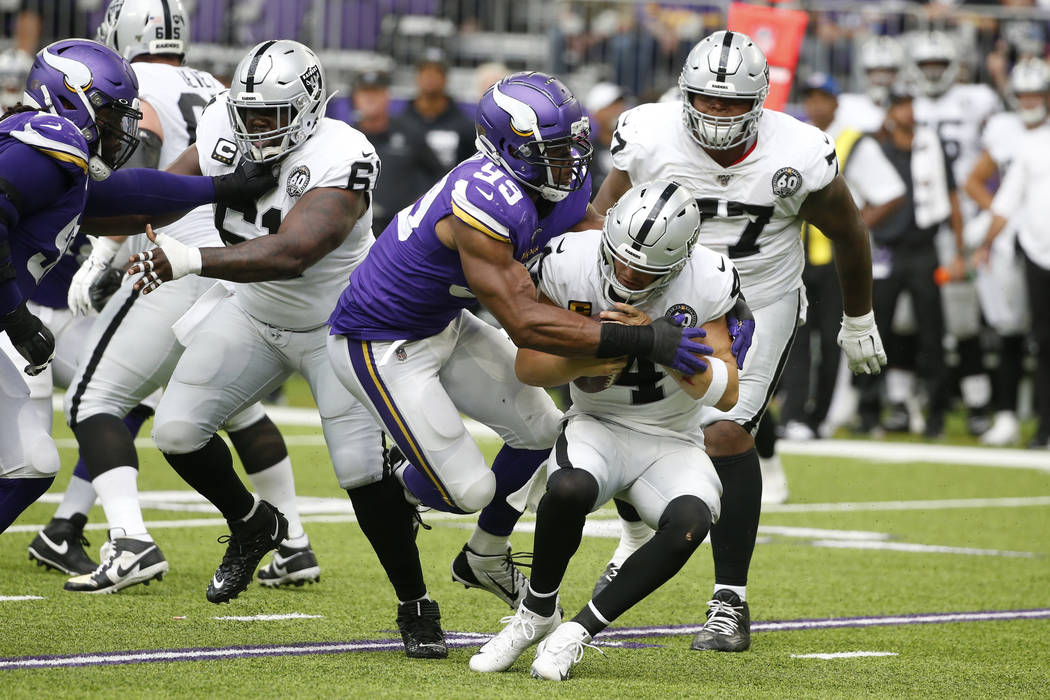 Minnesota Vikings defensive end Danielle Hunter (99) sacks Oakland Raiders quarterback Derek Ca ...