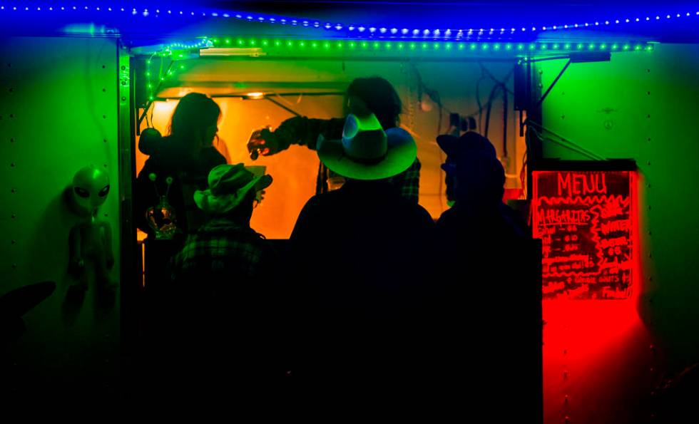 Festivalgoers stop by for a fresh margarita from Pioche vendors during the Alienstock festival ...