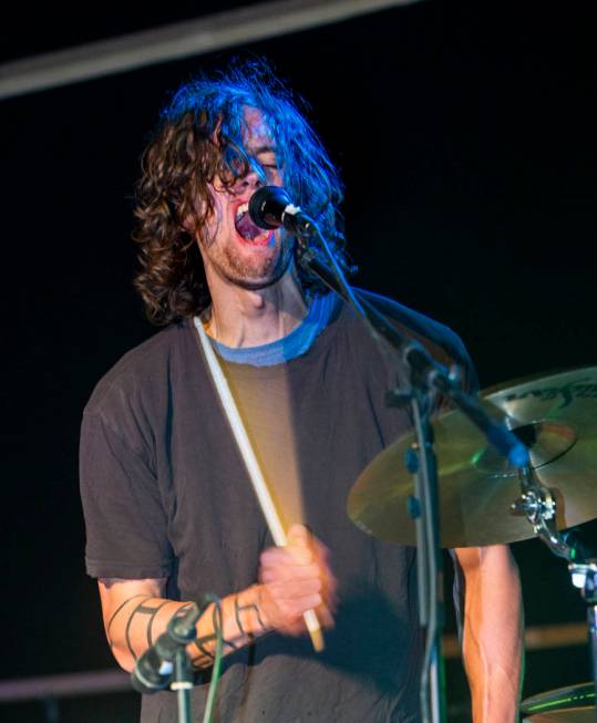 Scott Simpson of Dog Lord belts out his last song of the night before festivalgoers during the ...