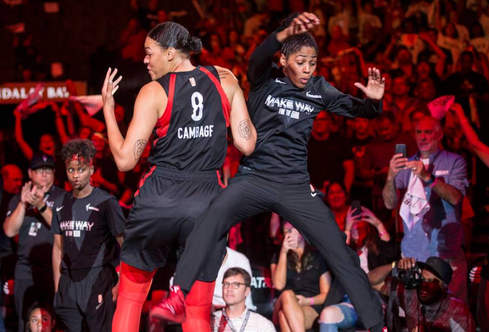 Las Vegas Aces center Liz Cambage (8) gets fired up with teammate Sydney Colson (51) before the ...