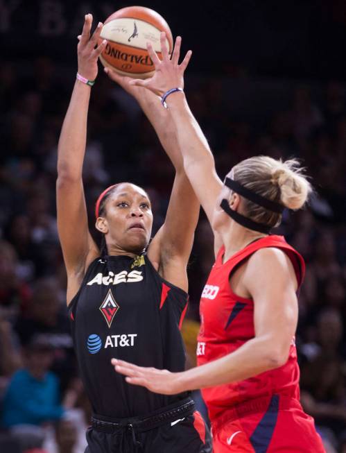 Las Vegas Aces center A'ja Wilson (22) shoots a corner jump shot over Washington Mystics forwar ...