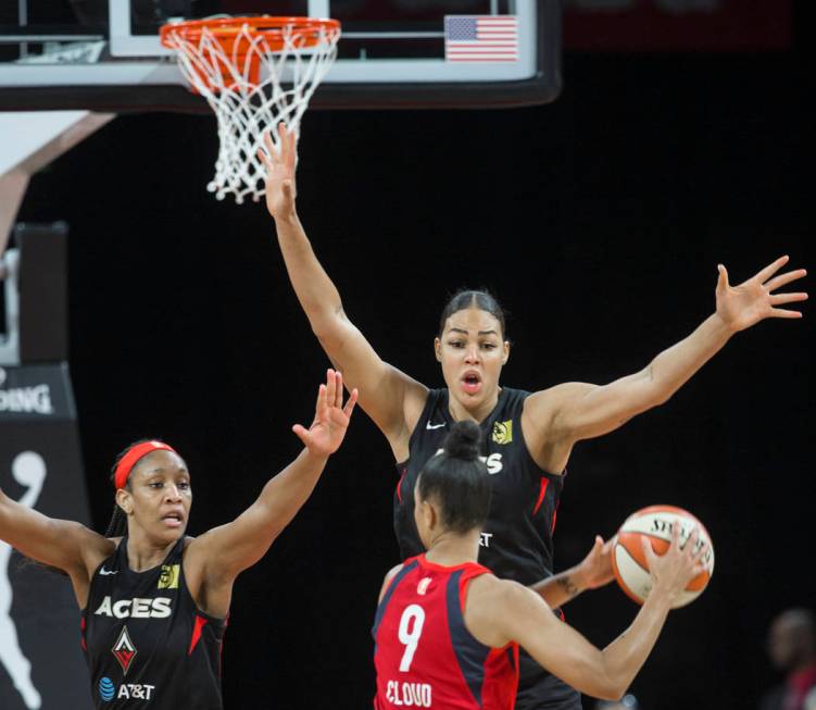 Las Vegas Aces center A'ja Wilson (22) and Las Vegas Aces center Liz Cambage (8) defend Washing ...