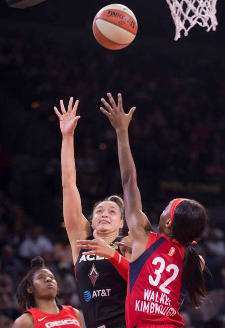 Las Vegas Aces guard Kayla McBride (21) shoots over Washington Mystics guard Shatori Walker-Kim ...