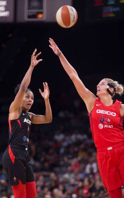 Las Vegas Aces guard Sydney Colson (51) shoots over Washington Mystics forward Elena Delle Donn ...