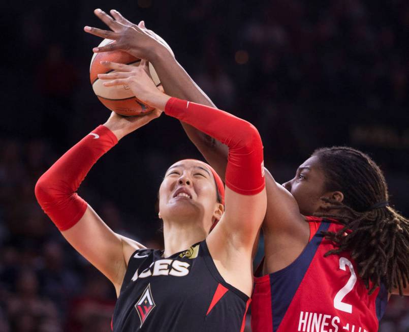 Las Vegas Aces center Ji-Su Park (19) gets fouled by Washington Mystics forward Myisha Hines-Al ...