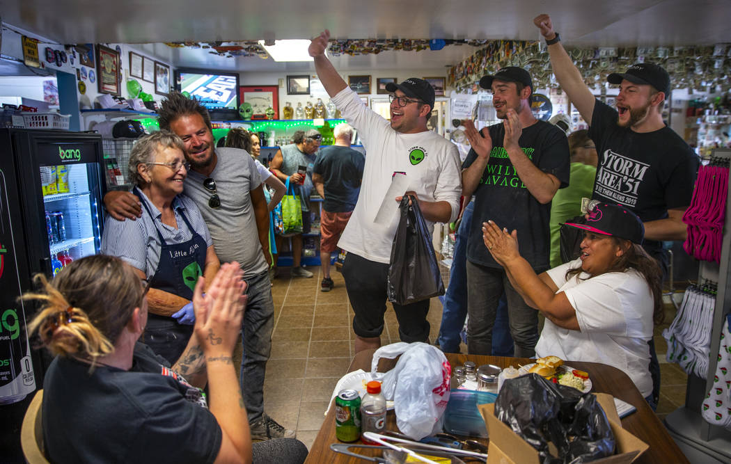 Pat Travis of the Little A'Le'Inn, left, is applauded by supporters and her daughter Connie Wes ...