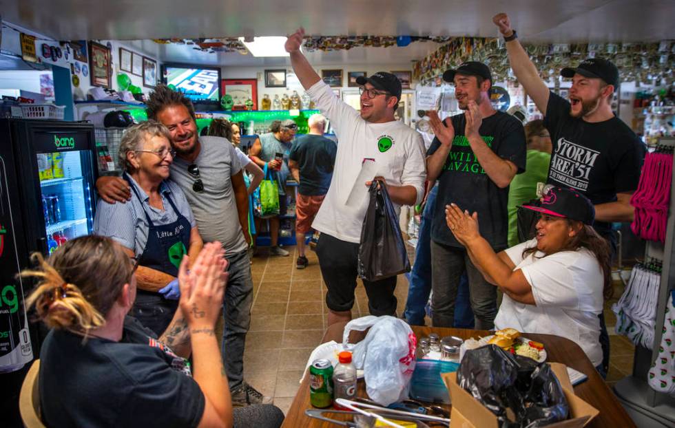 Pat Travis of the Little A'Le'Inn, left, is applauded by supporters and her daughter Connie Wes ...