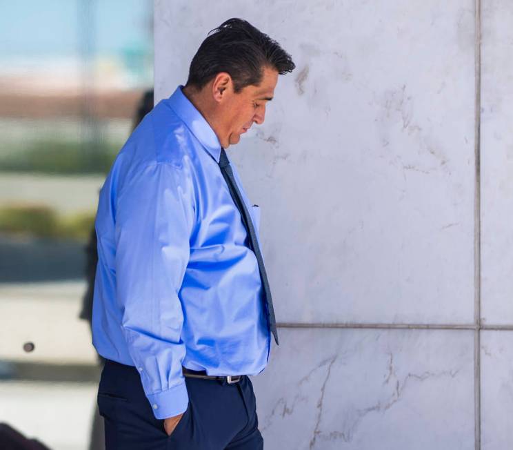 Defendant Bradley Campos departs the Lloyd D. George Courthouse following opening statements in ...