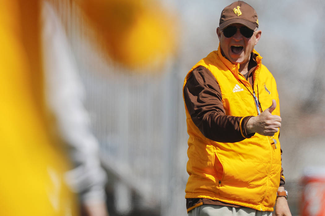 Wyoming coach Craig Bohl calls out to a referee during the NCAA college football team's spring ...