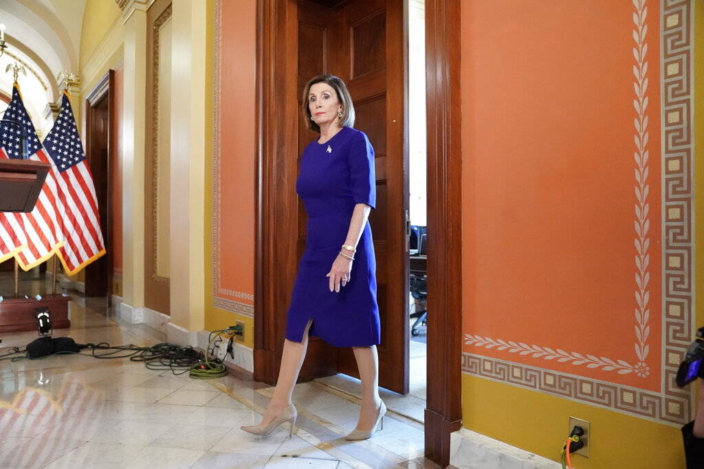 House Speaker Nancy Pelosi of Calif., walks out to read a statement announcing a formal impeach ...
