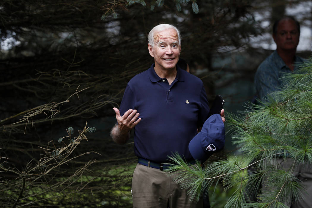 Democratic presidential candidate former Vice President Joe Biden waits to speak at the Polk Co ...