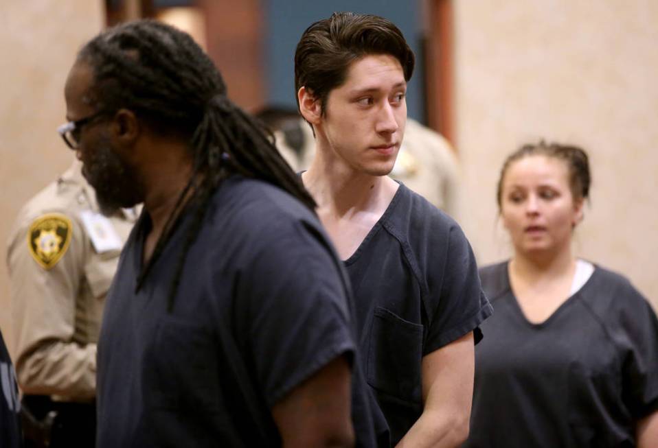 Giovanni Ruiz, 21, second from right, walks into the courtroom at North Las Vegas Justice Court ...