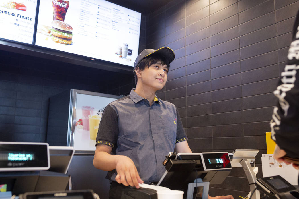 Crew member Jacob Zamora takes a customer's order at the McDonald's on the corner of Sahara Ave ...
