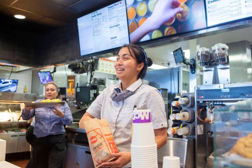 Shift manager Krizia Zamora fulfills an order at the McDonald's on the corner of Sahara Avenue ...