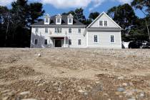 In a Sept. 3, 2019, photo a newly constructed home rests on a plot of land, in Westwood, Mass. ...