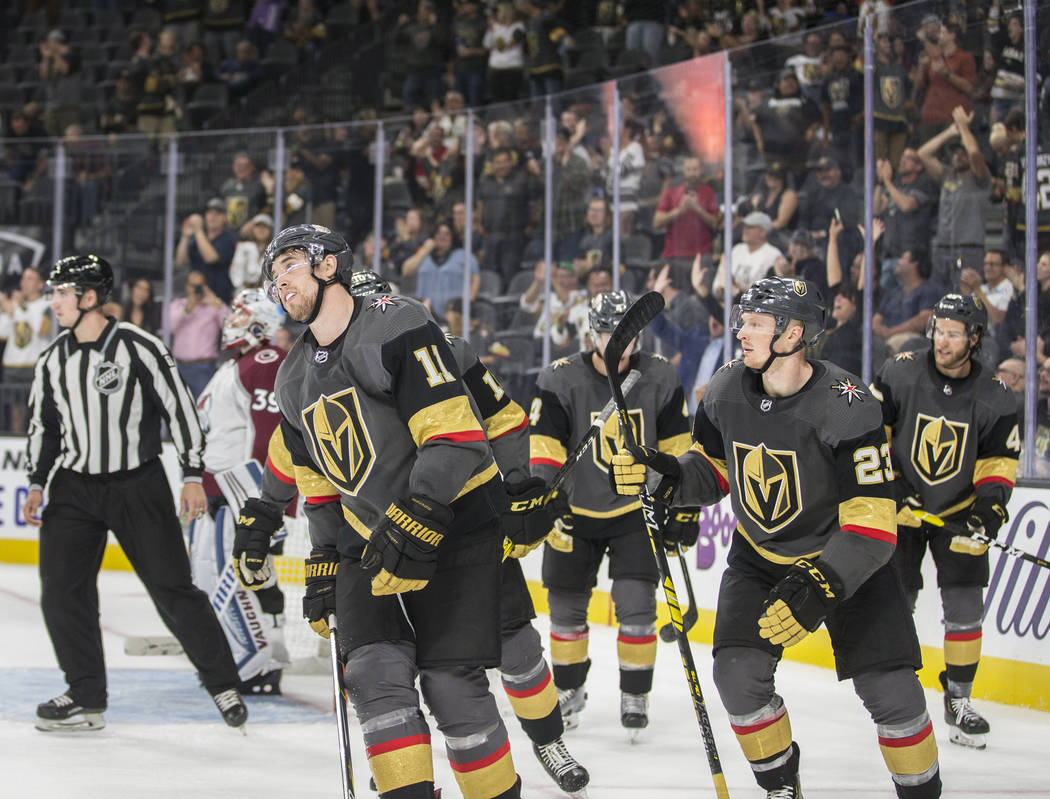 Vegas Golden Knights left wing Curtis McKenzie (11) and Vegas Golden Knights center Patrick Bro ...