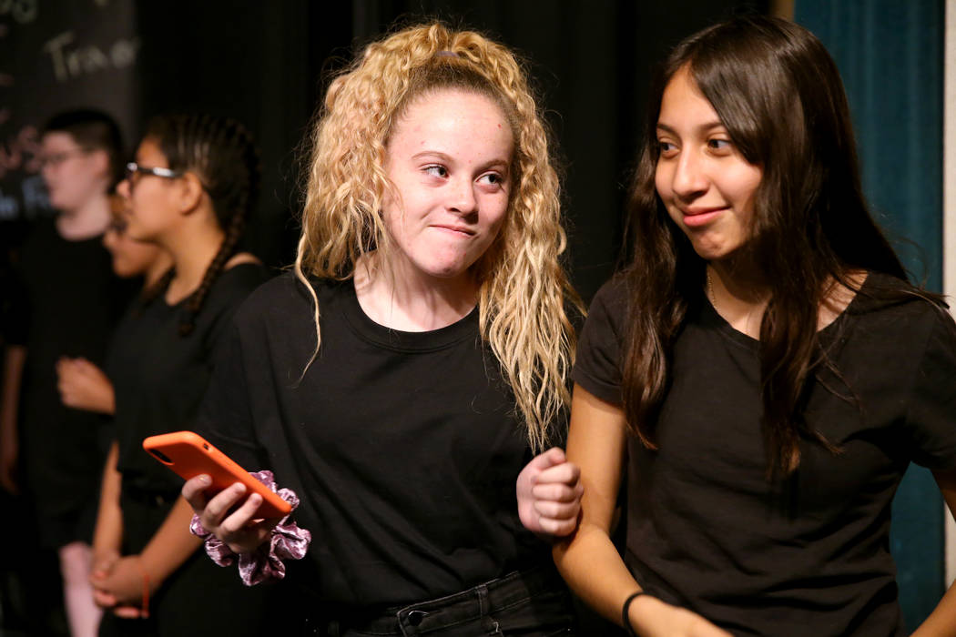 Eighth grade students Elisabeth Farris, left, and Jada Anaya cyber bully during a rehearsal for ...