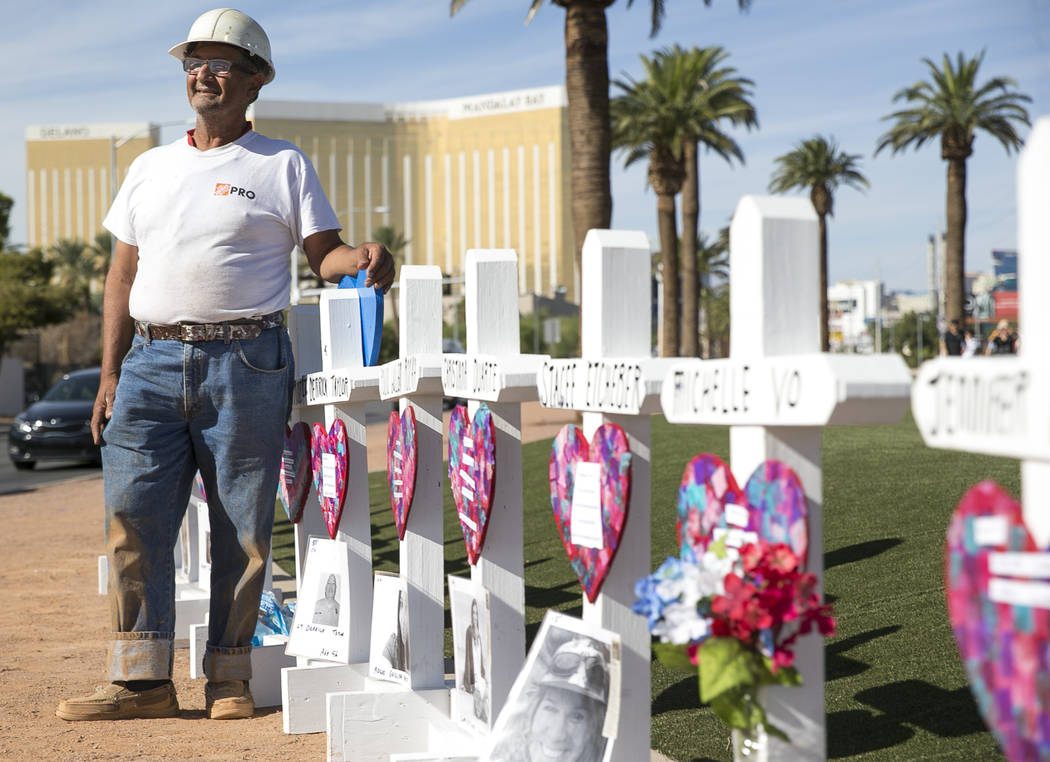 Greg Zanis, of Aurora, Ill., next to the 58 crosses he placed near the Welcome to Fabulous Las ...