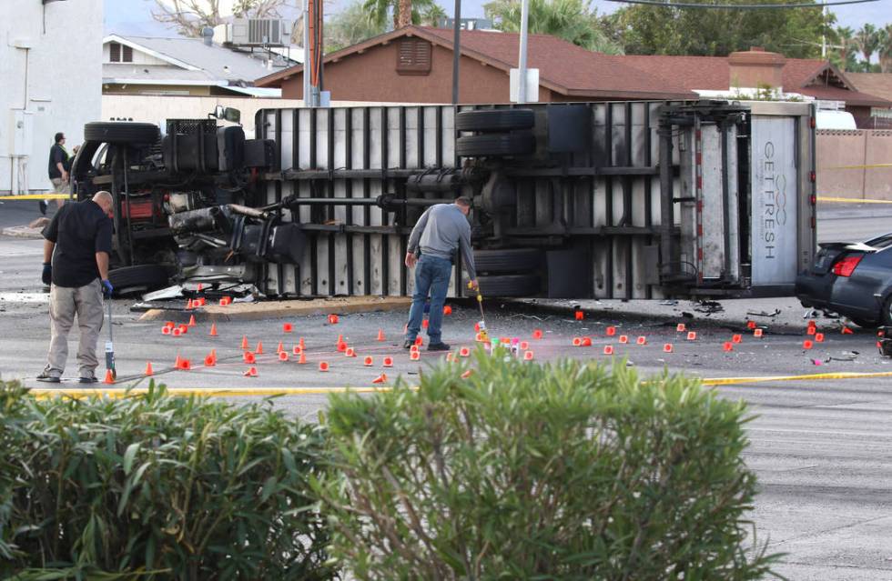 Las Vegas police investigate fatal crash involving two cars and a box truck at East Tropicana A ...