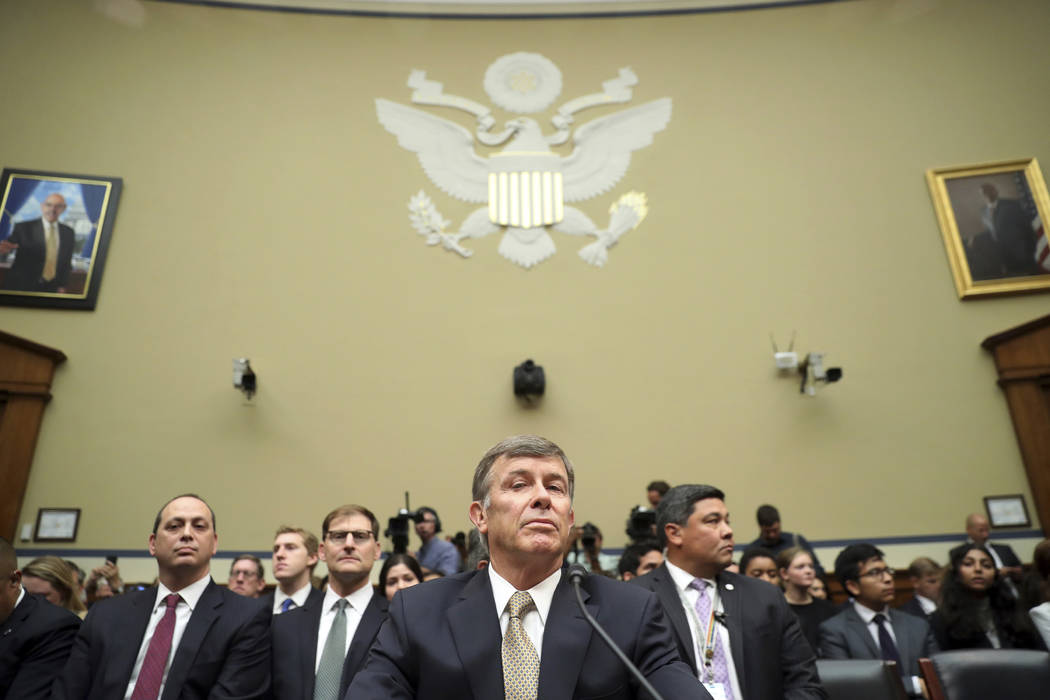 Acting Director of National Intelligence Joseph Maguire takes his seat before testifying before ...
