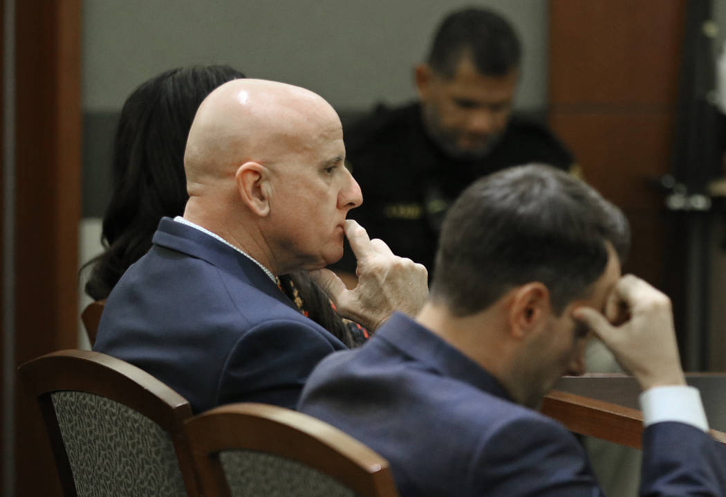 Las Vegas police Lt. James "Tom" Melton, left, and defense attorney Josh Tomsheck wai ...