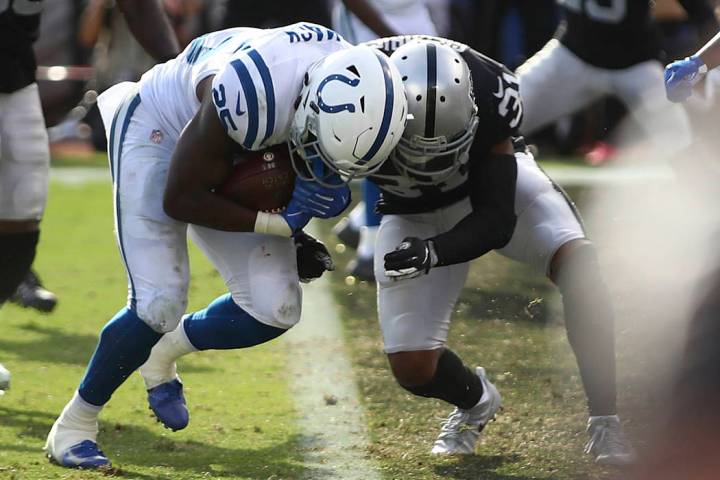 Indianapolis Colts running back Marlon Mack, left, runs for a touchdown against Oakland Raiders ...