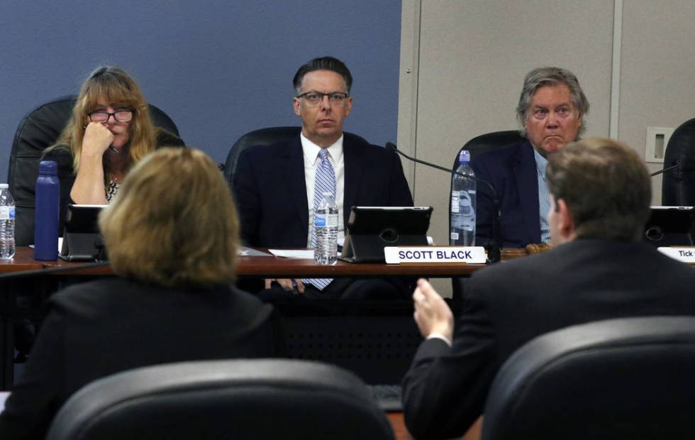 Scott Black, center, the Southern Nevada Health District chairman, vice chairwoman Marilyn Kirk ...