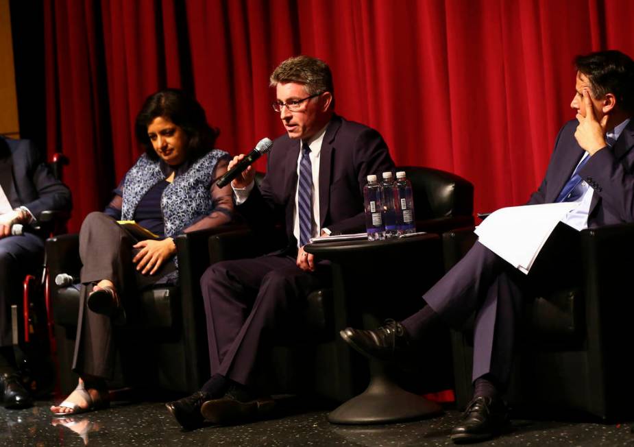 Michael Kagan, professor at UNLV's Boyd School of Law, center, speaks during a panel about Isla ...