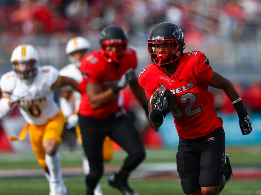 UNLV defensive back Jericho Flowers (32) runs the ball to score a touchdown during a football g ...