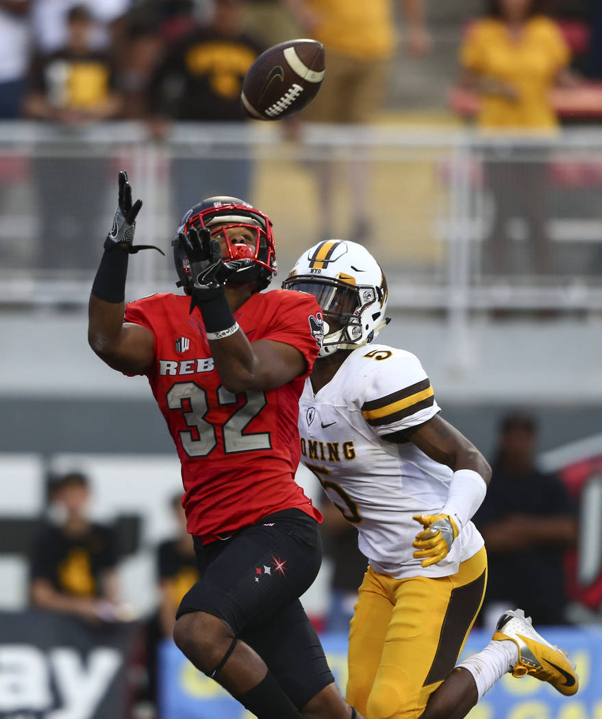 UNLV defensive back Jericho Flowers (32) receives a pass in the end zone to score a touchdown d ...