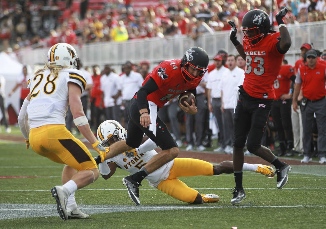 UNLV quarterback Kurt Palandech (14) runs the ball during a football game against Wyoming at Sa ...