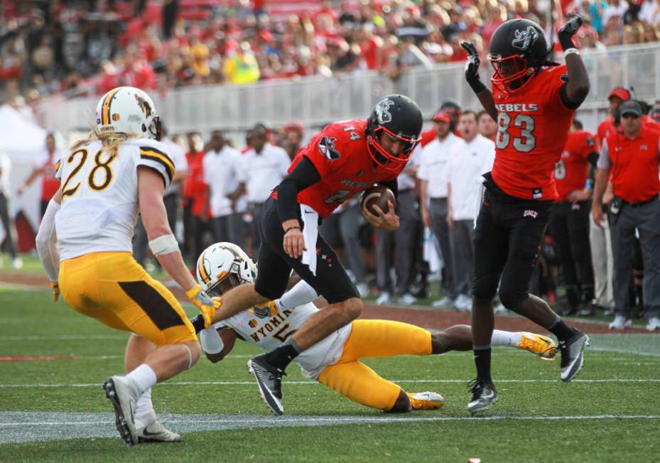 UNLV quarterback Kurt Palandech (14) runs the ball during a football game against Wyoming at Sa ...