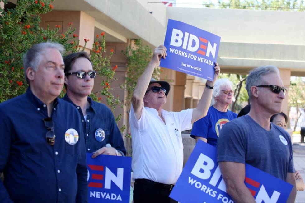 Supporters of Democratic presidential candidate former Vice President Joe Biden hold signs at t ...