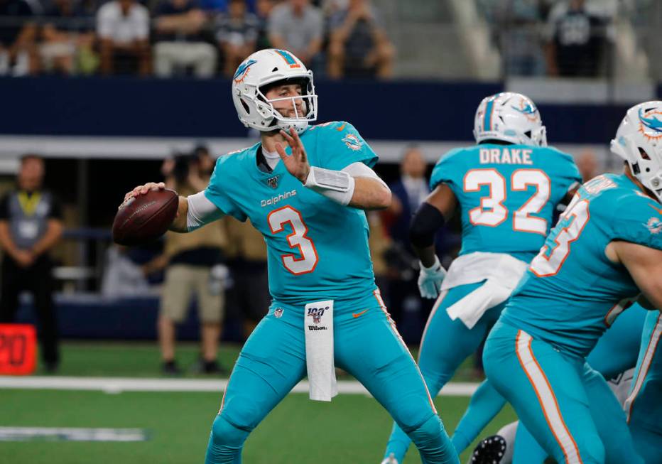 Miami Dolphins quarterback Josh Rosen (3) throws against the Dallas Cowboys during a NFL footba ...