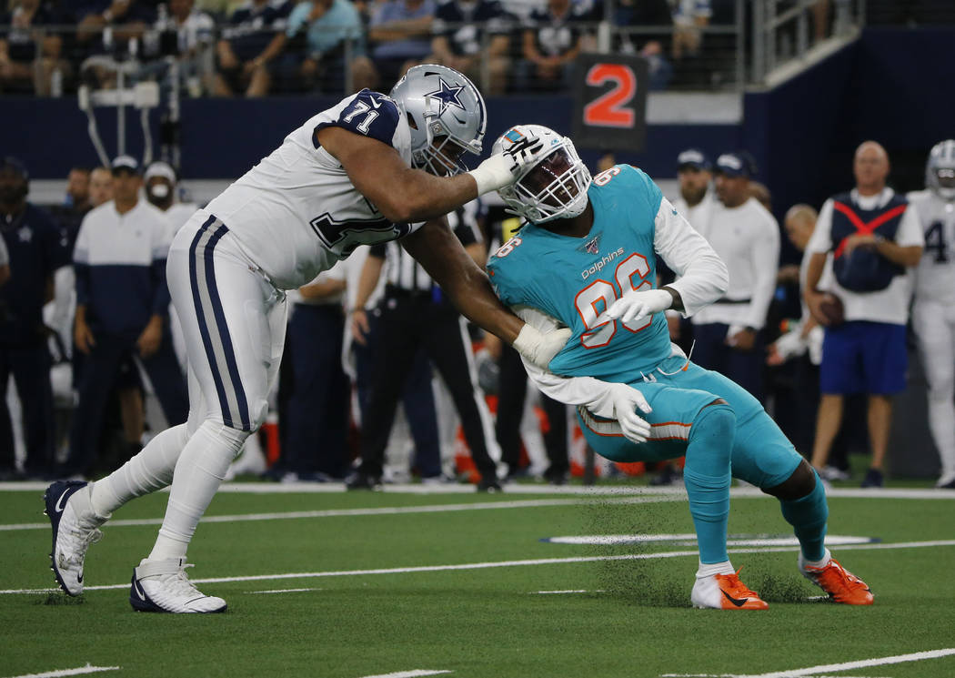 Dallas Cowboys offensive tackle La'el Collins (71) blocks Miami Dolphins defensive end Taco Cha ...