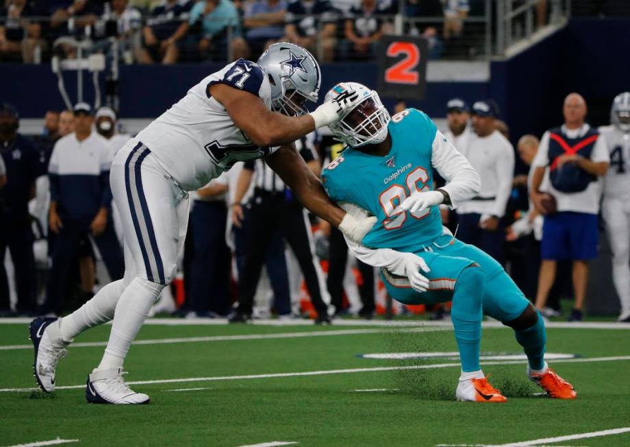 Dallas Cowboys offensive tackle La'el Collins (71) blocks Miami Dolphins defensive end Taco Cha ...