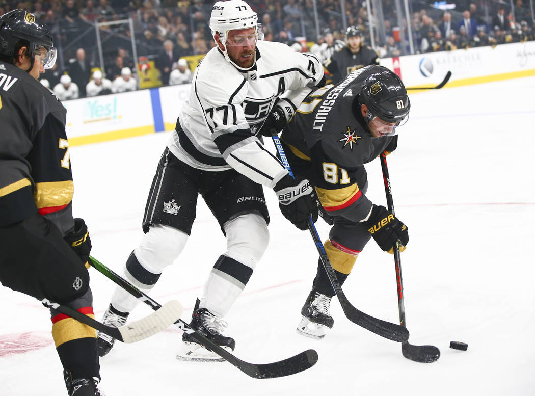Golden Knights' Jonathan Marchessault (81) battles for the puck against Los Angeles Kings' Jeff ...